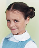 A photo of a girl with a simple backgound