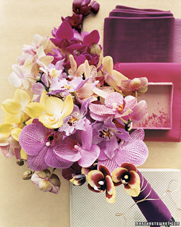 This second striking bouquet is an exotic mix of varying orchid varieties 